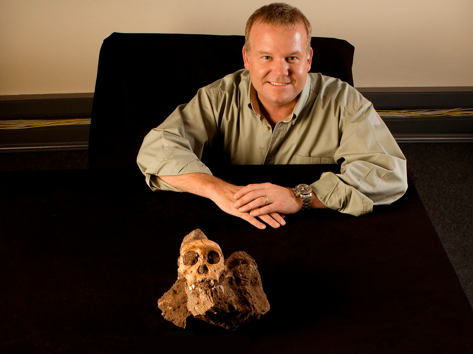 Professor Lee Berger with Australopithecus sediba